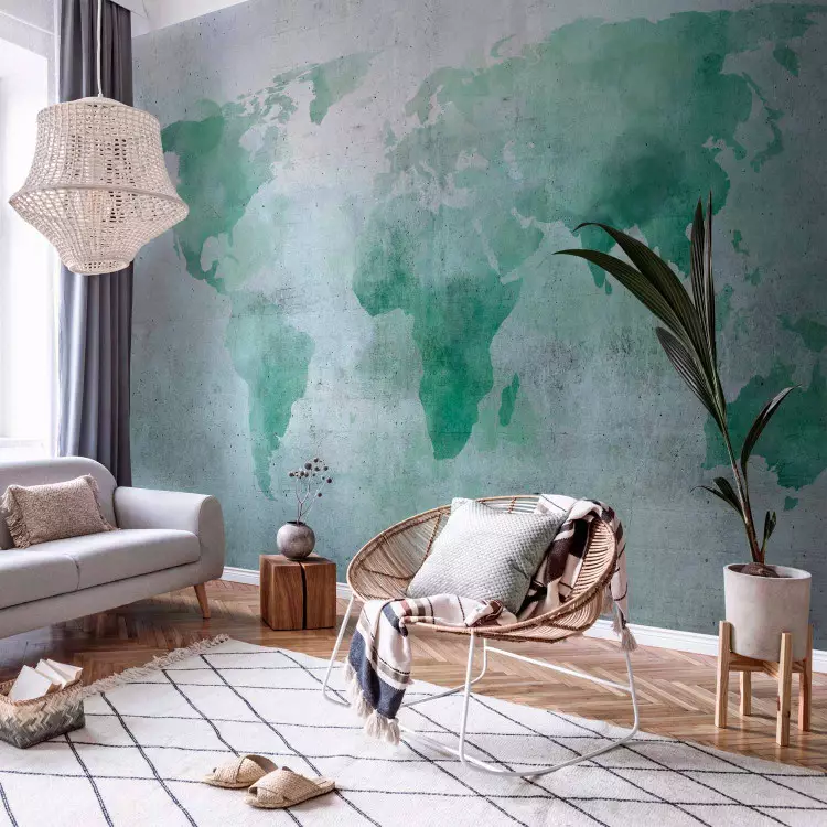 Mintgroene wereld - aquarelwereldkaart op een achtergrond met betonnen patronen