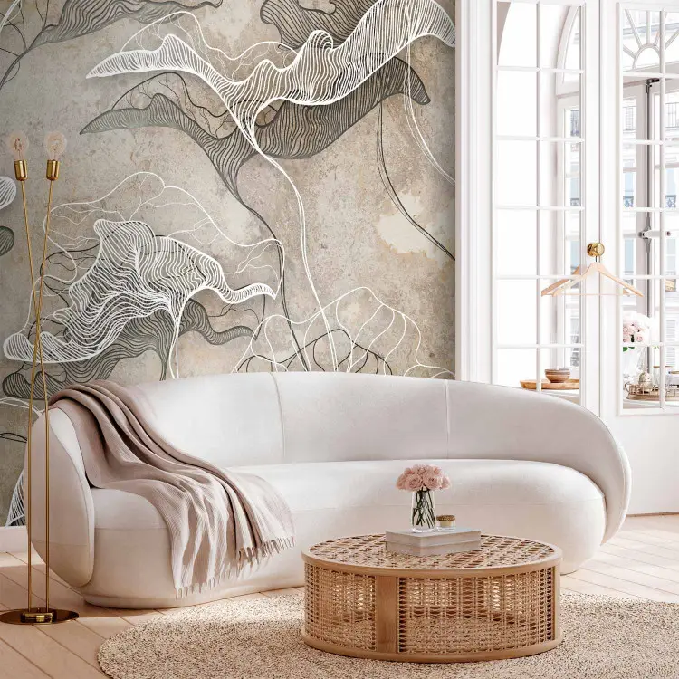 Getekende natuur - witte lineart bladeren die een schaduw werpen op een beige muur