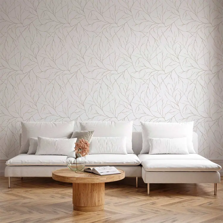 Minimalisme - lichtbeige takken met elkaar verstrengeld op een witte achtergrond