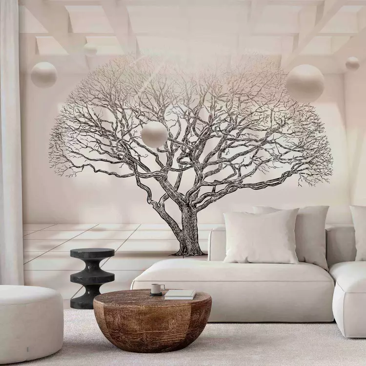 Geometrisch landschap - bladloze boom in een beige ruimte met ballen